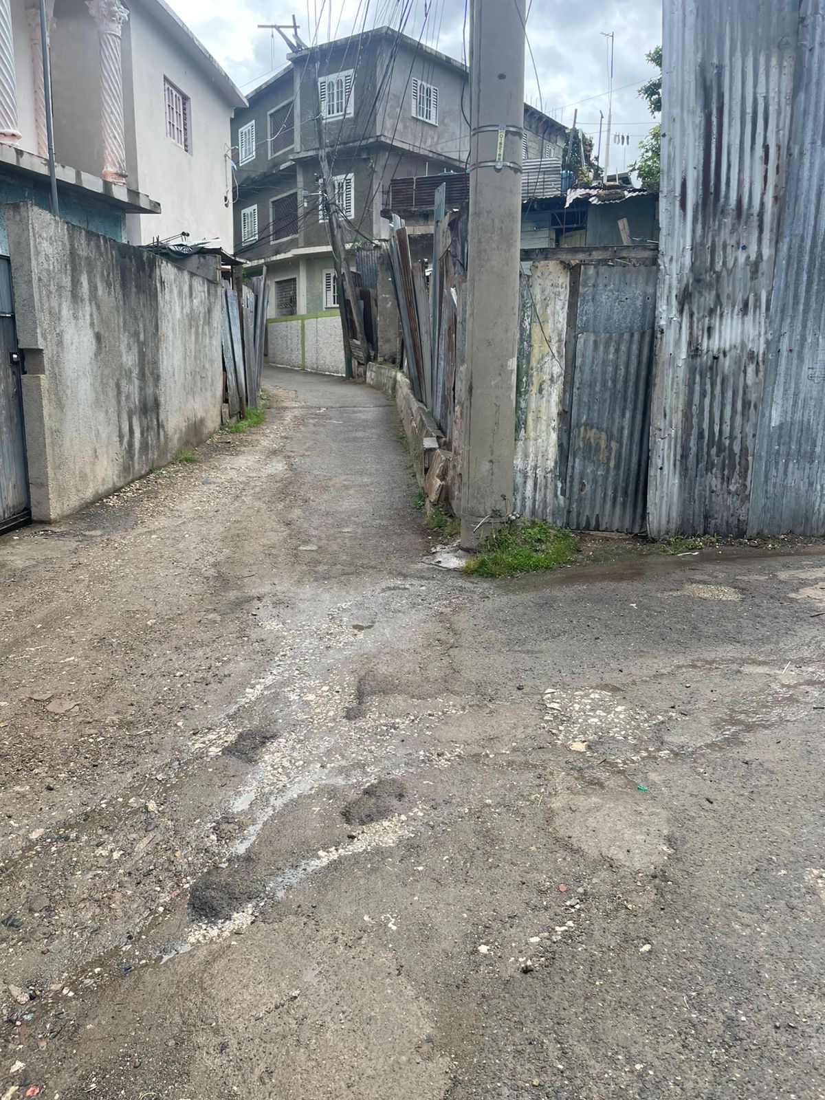 Cassava Piece, Kingston — the narrow lanes and zinc fences where Joey Brooks grew up